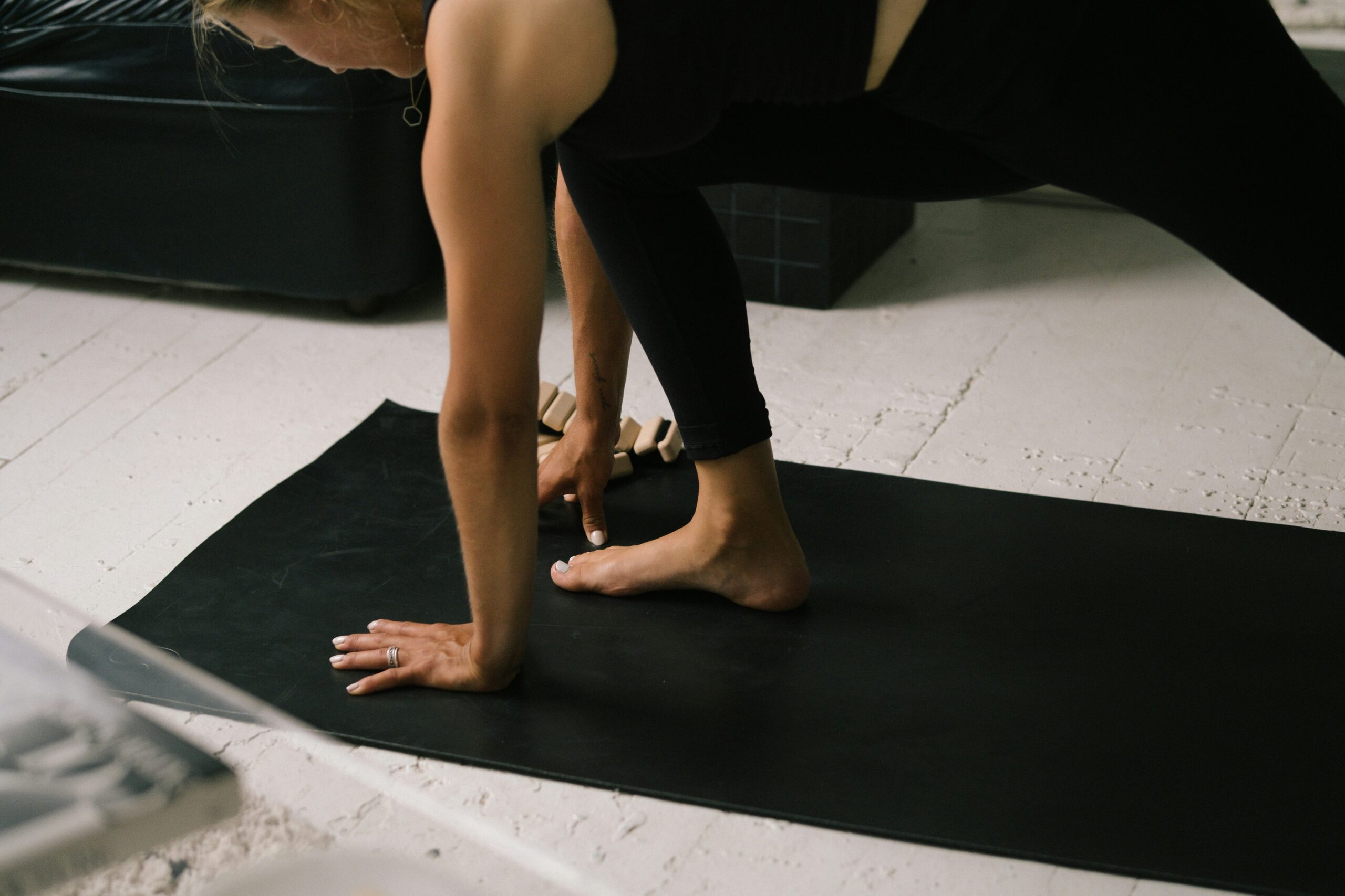 Pilates instructor guiding a class